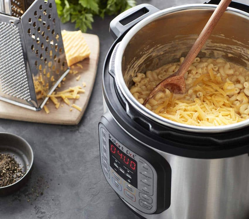 Kitchen counter with cheese grater, and instant pot appliance