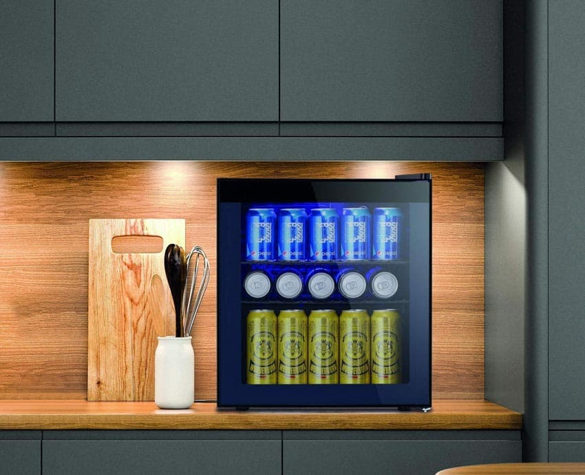 Kitchen counter with wood backsplash, cabinets, and beverage cooler