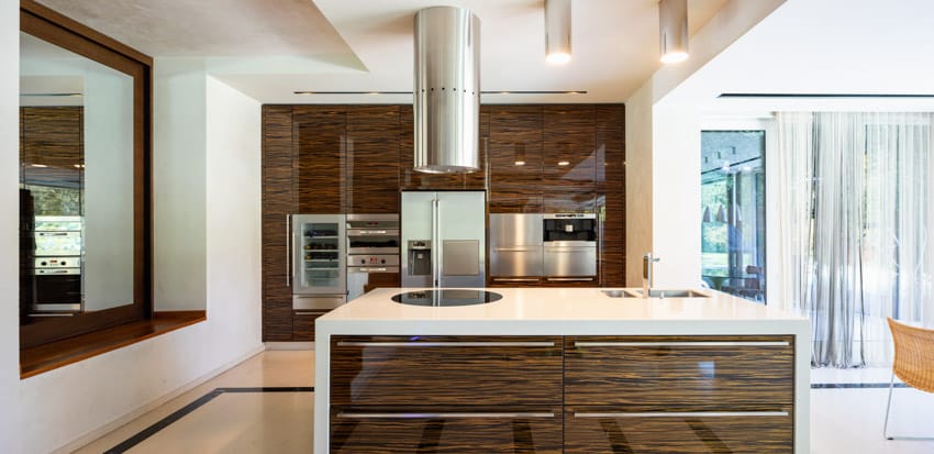 Kitchen with modern stovetop island prep area and glossy cabinets