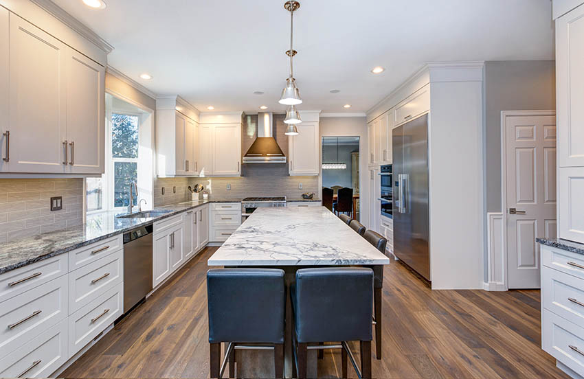 Kitchen with mixed grey white marble countertops white cabinets