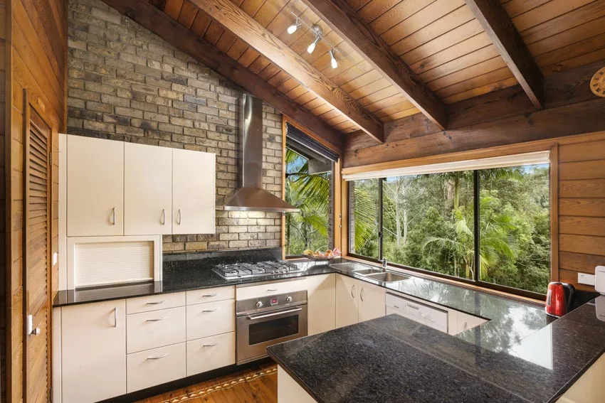 Kitchen with granite and tile backsplash