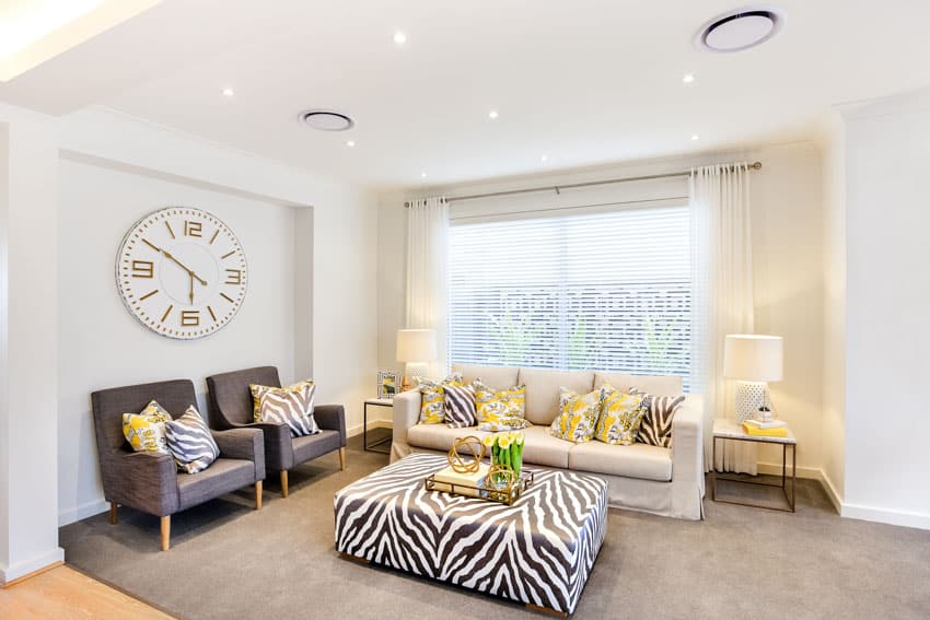 living room with wall clock and furniture set