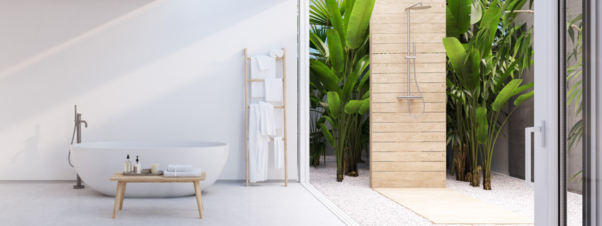 Shower near an indoor tub and towel rack