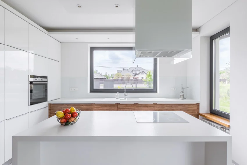 Kitchen with white laminate countertops