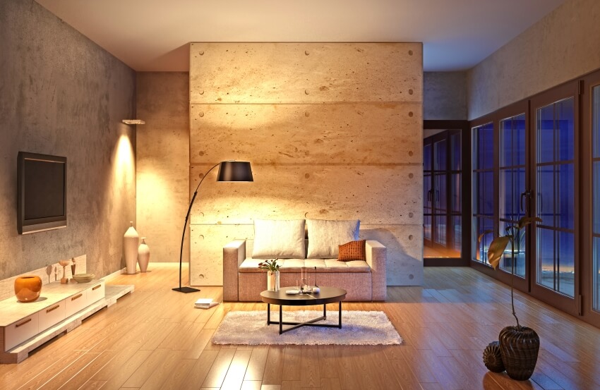 Modern living room with concrete walls, wood floor, mood lighting, and French doors