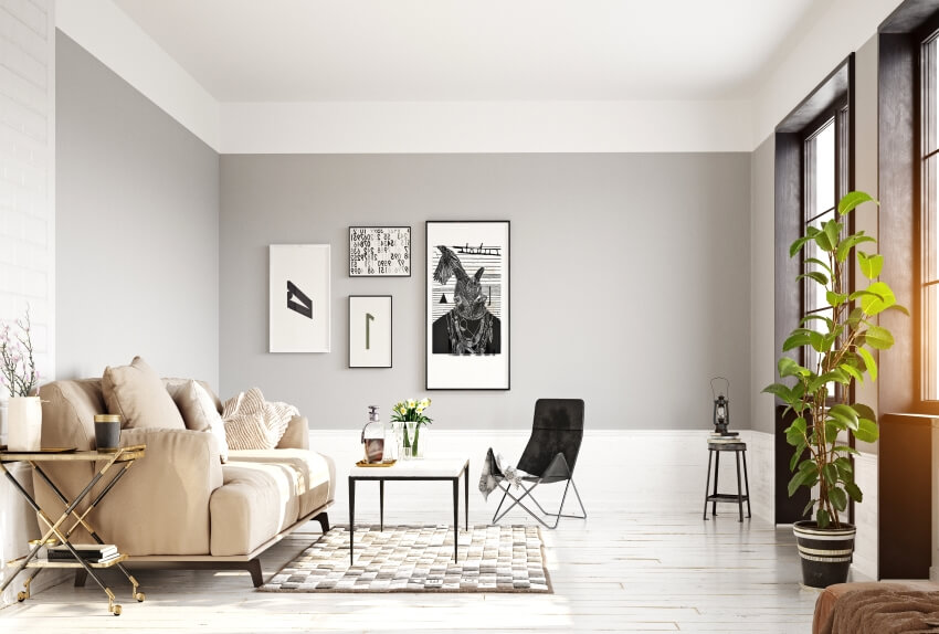 Modern interior with panel wood floor, grey walls, large sofa, and cross leg table