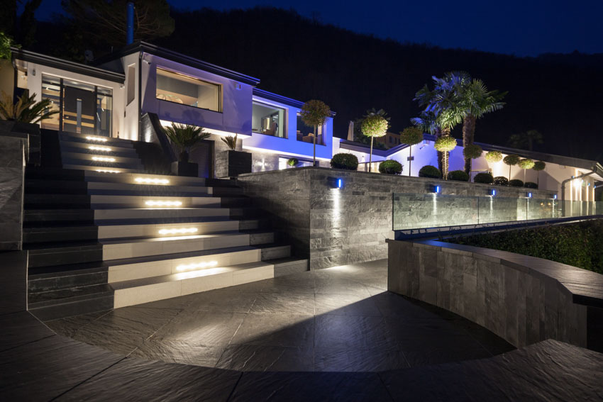 Modern luxury villa with color changing landscape lights