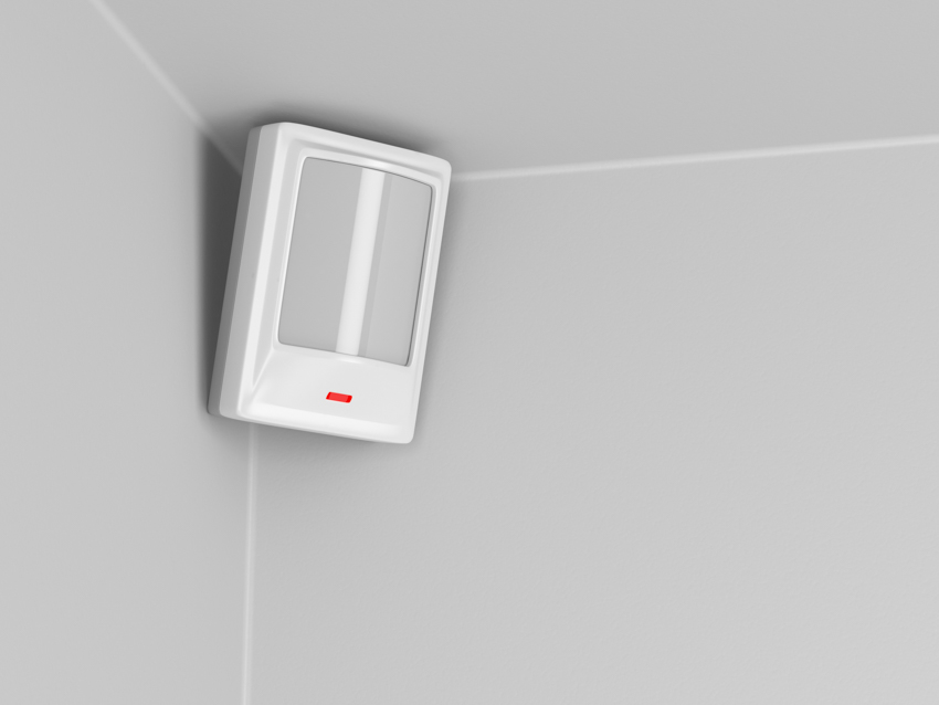 Motion sensor light installed on corner of wall