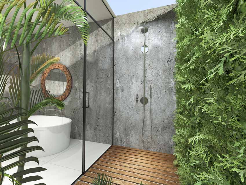 Outdoor bath and shower with glass door dividing the two