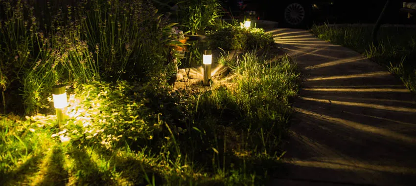 Outdoor post lighting installed on garden grounds