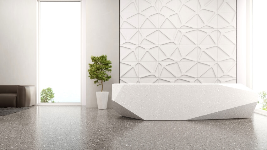 Polygonal shape counter in entrance hall with epoxy terrazzo flooring and panoramic window