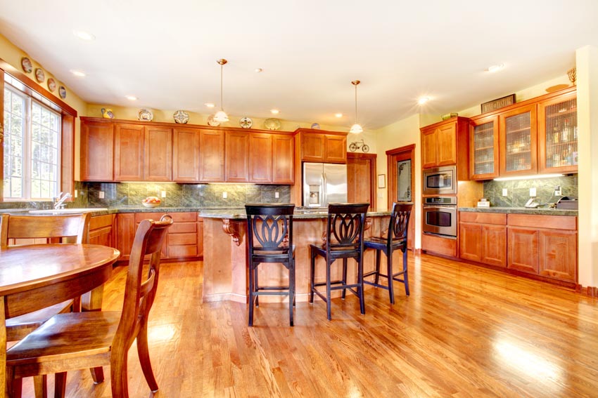 Spacious kitchen with backlit granite slab and countertops