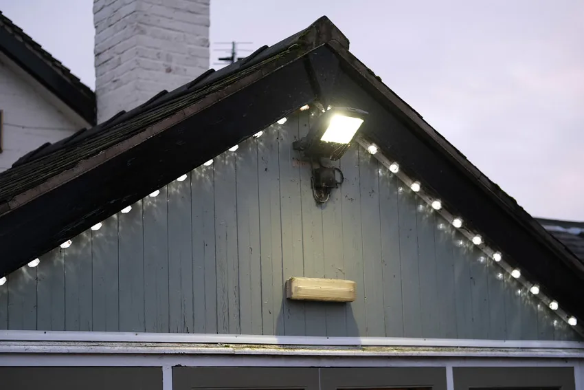 Spotlight installed near house roof