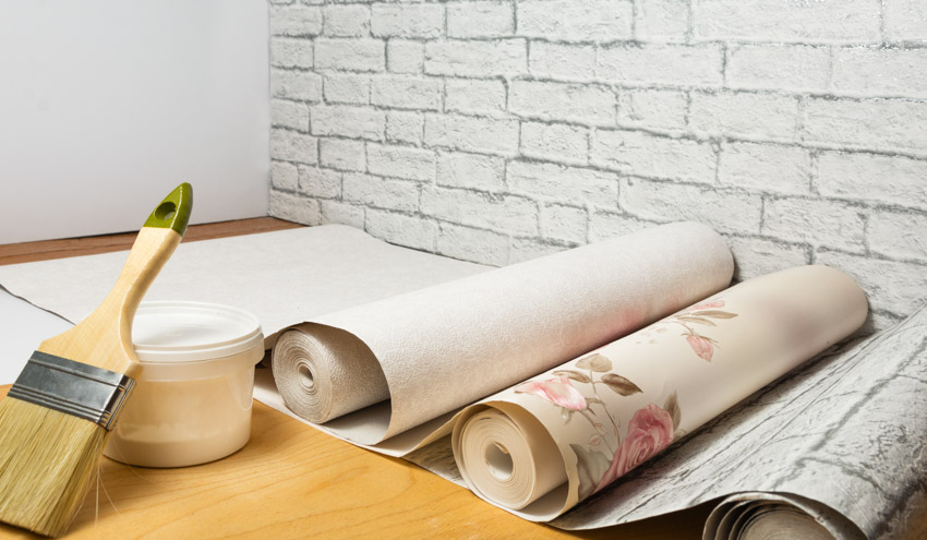 Roll of wallpaper on table