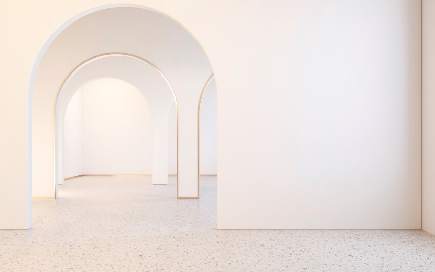 White interior with arches and terrazzo floor