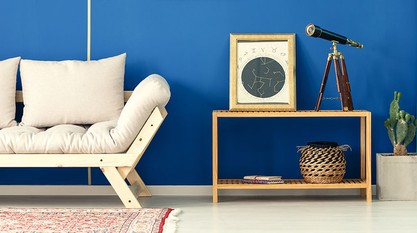 Loveseat and console table blue wall