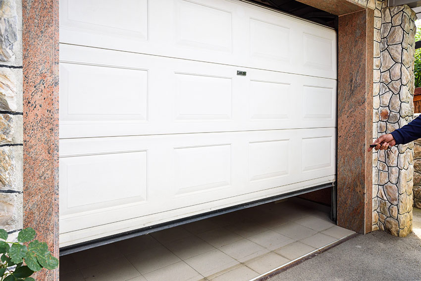 Sectional door with white paint opening to garage