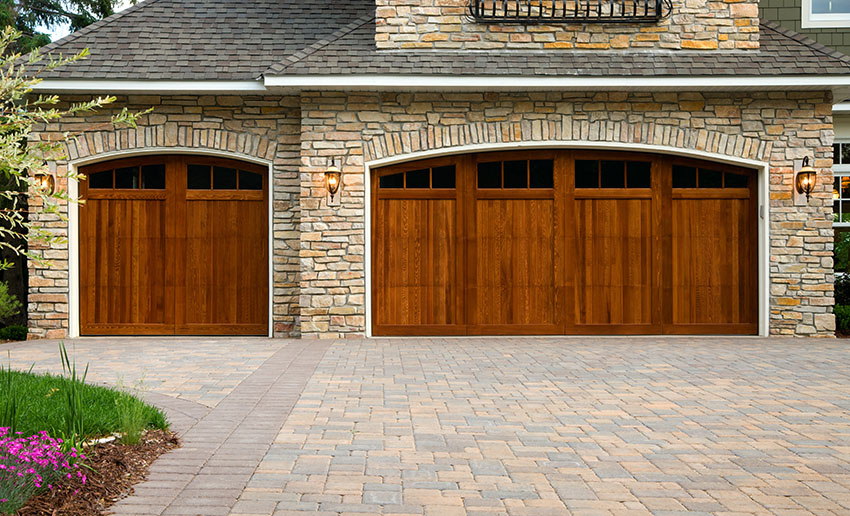 Wood panel garage with brick flooring entryway stone cladding wall