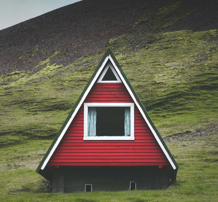 A frame modern type of cabin with red siding