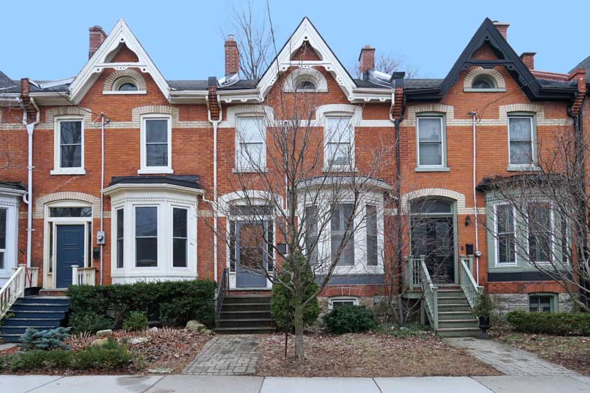 Residential houses with pitched roofs and colorful front doors,