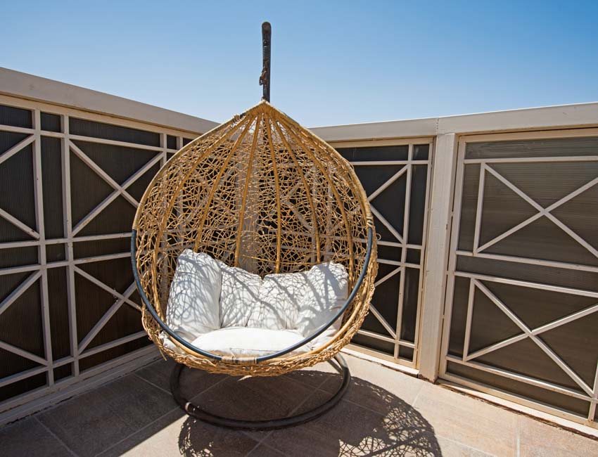 Accent egg chair with cushion in an outdoor area
