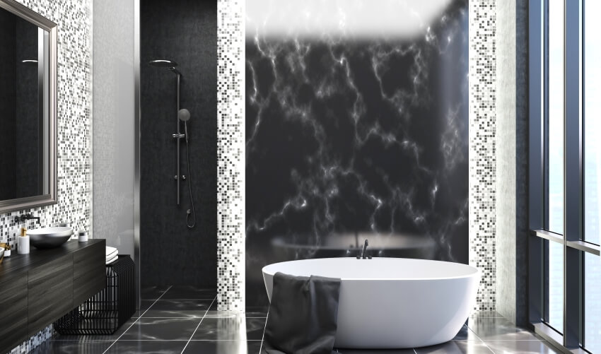 Bathroom interior with a black marble floor, mosaic tile wall, a white bathtub, and round sink
