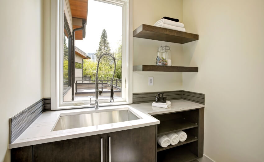 Bathroom with floating shelves and quartz countertop 