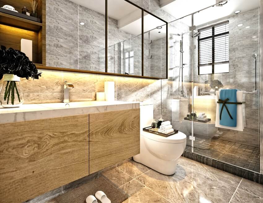 Bathroom with glass enclosed shower, tile walls and floor, and wooden vanity