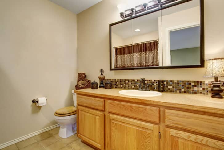 Bathroom With Honey Oak Cabinets Vanity Mirror Countertop And Toilet Is 728x486 