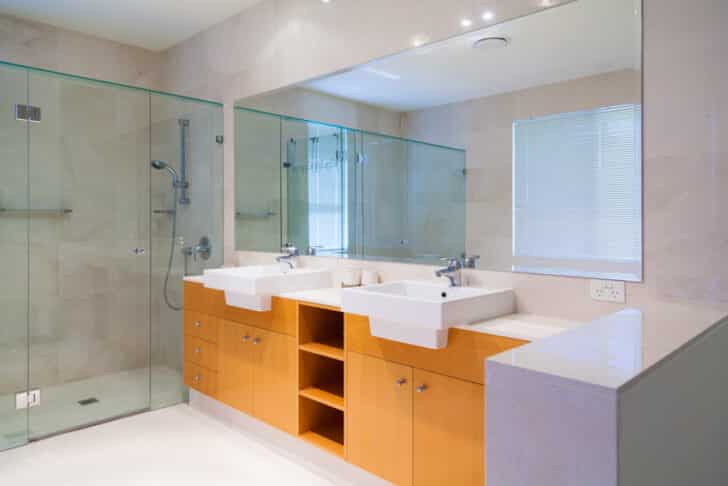 Bathroom With Shower Area Glass Door Honey Oak Cabinets Sinks Mirror And Faucets Is 728x486 