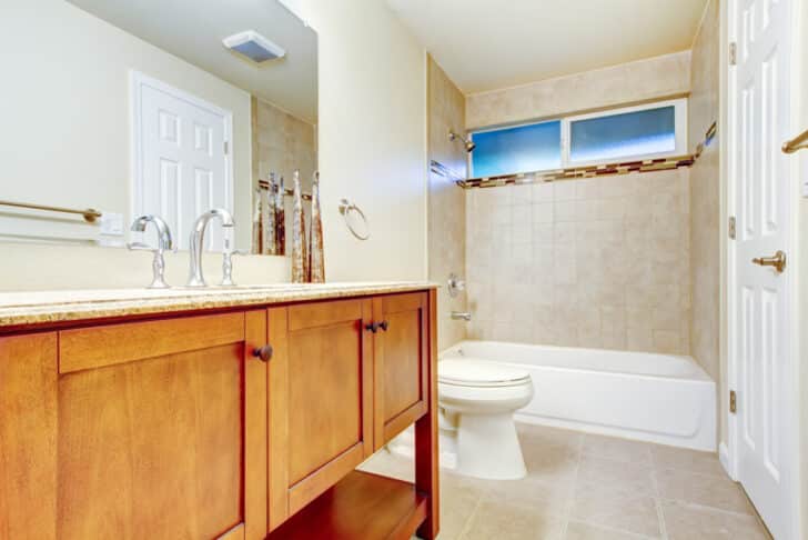 Bathroom With Vanity Mirror Honey Oak Cabinets Tub Toilet Window And Showerhead Is 728x486 