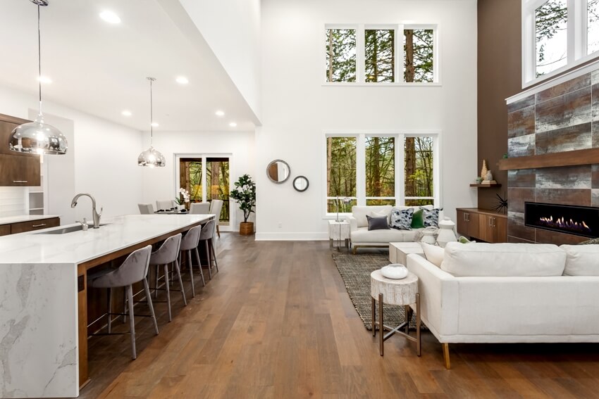 Room with white walls, waterfall wet counter and gas fireplace