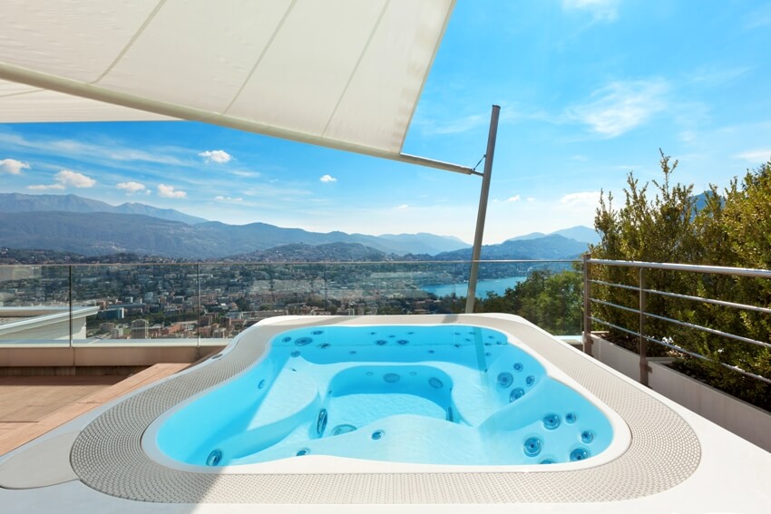 Beautiful terrace of penthouse with hot tub and stunning overlooking view of mountains