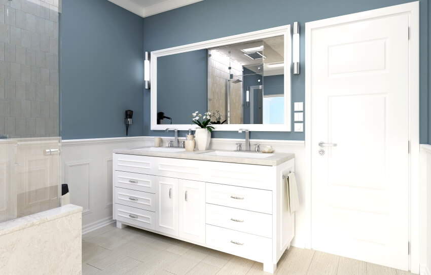 Classic bathroom with blue and white walls, and vanity with double under mounted sinks