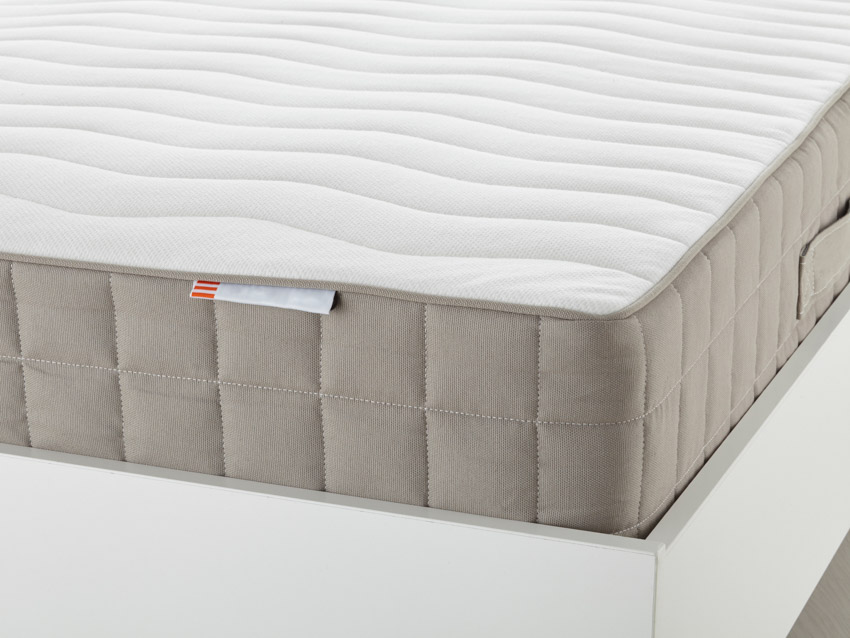 Close up image of white and brown latex mattress