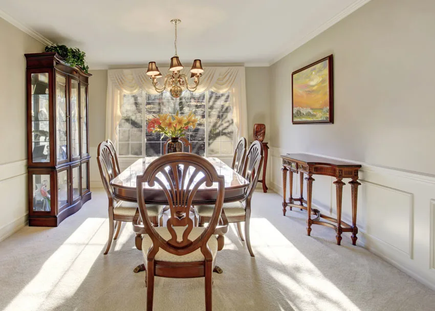 Room with white curtains, wood console table and marble floors