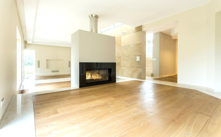 Fireplace in spacious room in apartment with uneven floor