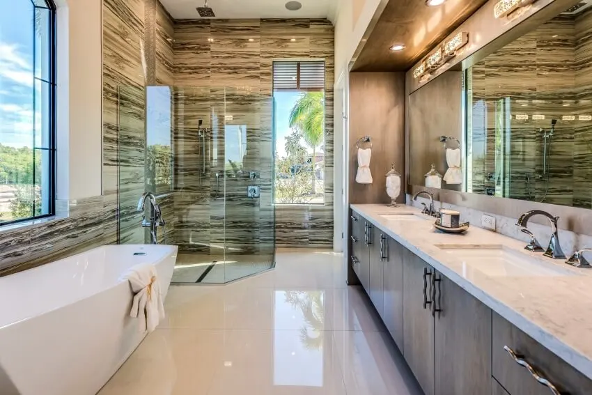 Freestanding tub and big glass shower in bathroom
