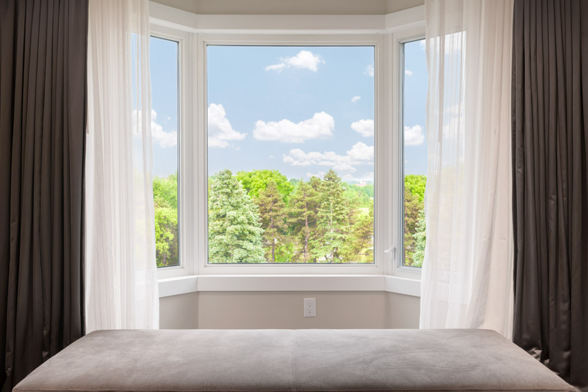 Glass windows with brown curtaiins