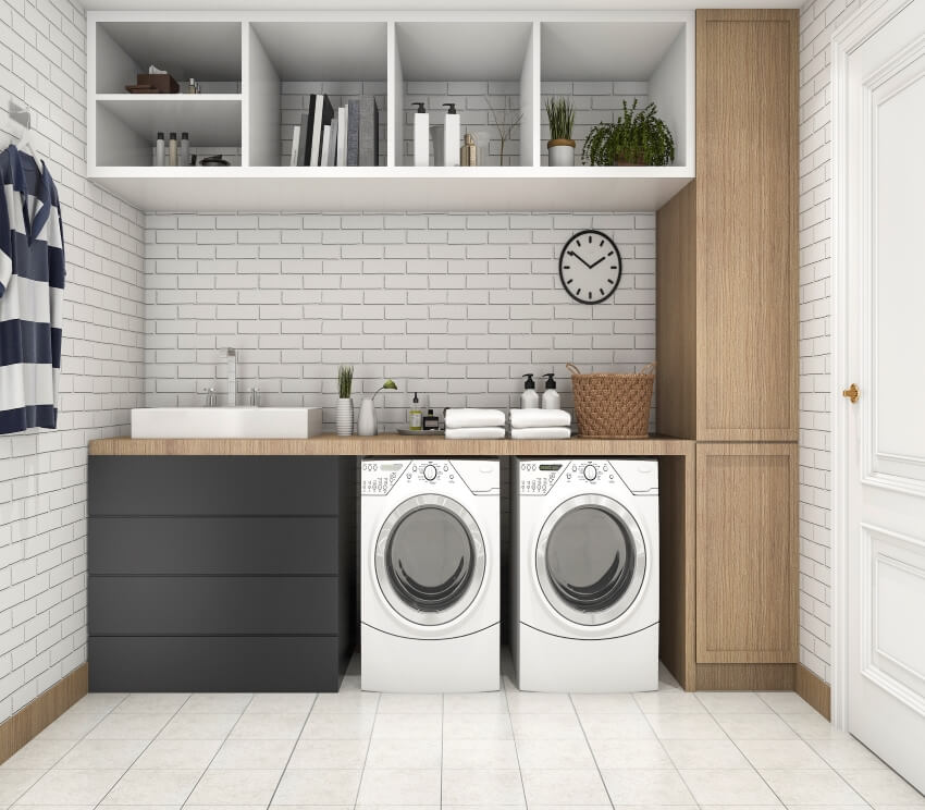 Laundry room with brick wall and backsplash, shelves, and wood countertops