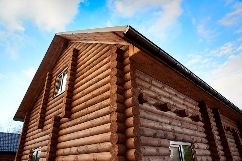 Log cabin exterior with roof and windows