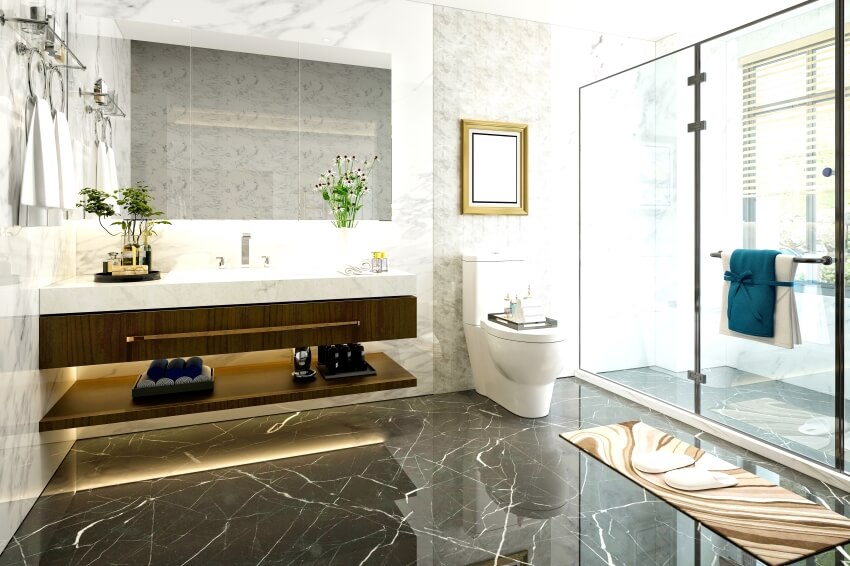 Luxurious bathroom with marble interior, floating vanity, and glass shelves