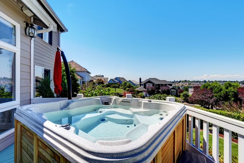 Luxury house exterior with wooden hot tub and an amazing view