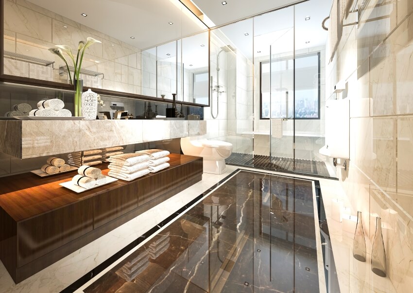 Luxurious bathroom with marble tile floor and a floating vanity with a large mirror