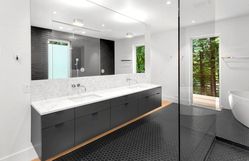 Modern bathroom with honeycomb tile floor and a double vanity with marble countertop