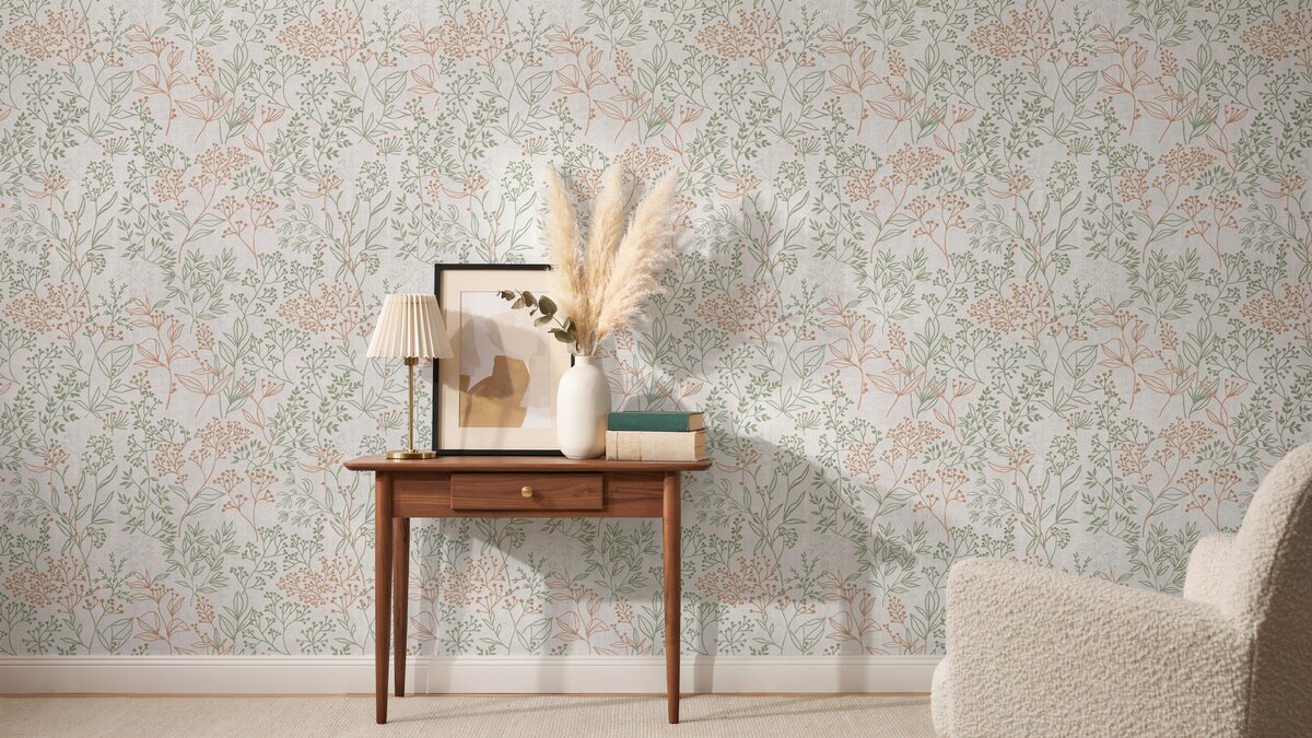 Living room wall in delicate non woven wallpaper with pink and sage pattern