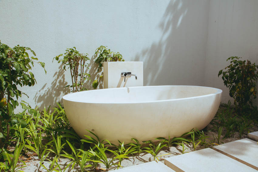 Simple outdoor bath with tub, and faucet