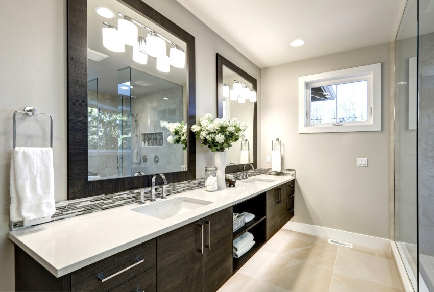 Spacious bathroom in gray tones with long double sink floating vanity and heated floors