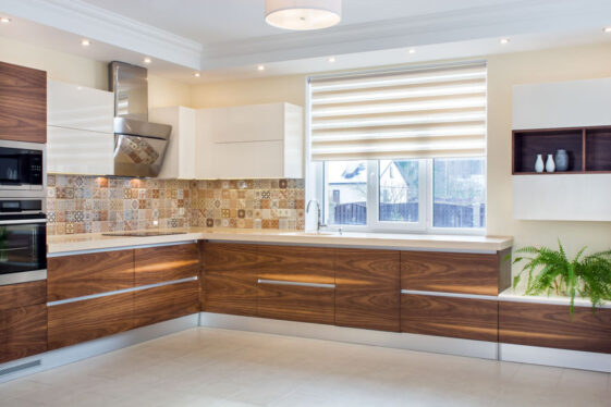 Horizontal Grain Kitchen Cabinets   Spacious Kitchen With Horizontal Grain Cabinets Ceiling Lights Tile Backsplash And Countertops Is 561x374 