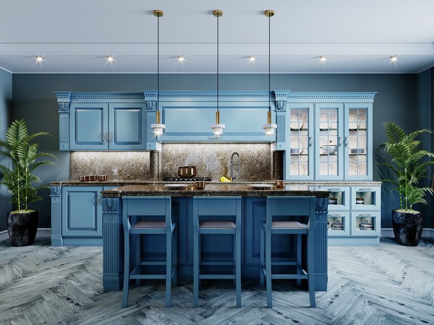 Unique kitchen interior with granite countertop island, blue painted cabinets and gray wood flooring 